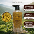 Bottle of Darjeeling Tea Bath Gel with tea leaves on a background of a tea field regenfall